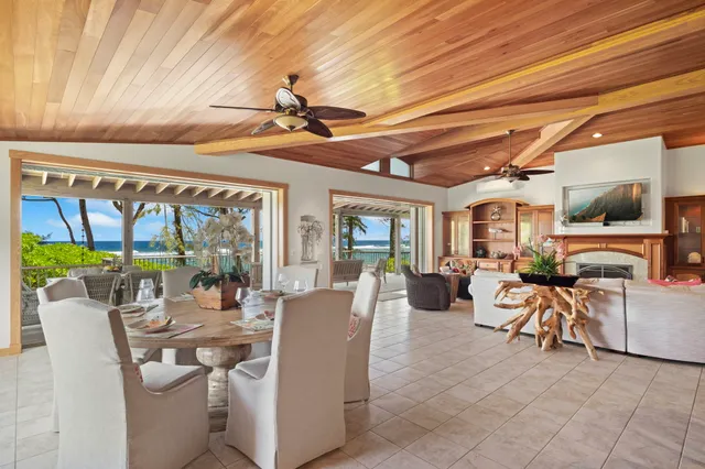 a view of a patio with table and chairs potted plants with sky view