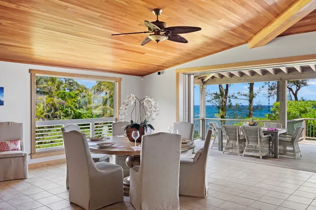a view of a dining room with furniture window and outside view