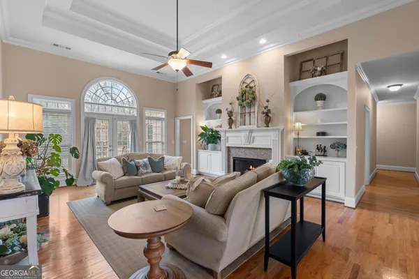 a kitchen with granite countertop a refrigerator oven a sink and dishwasher