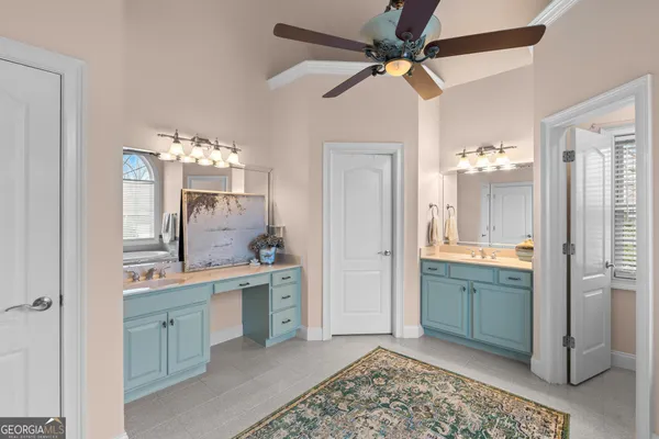 a room with a sink cabinets and utility room