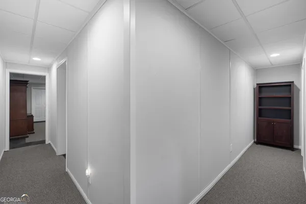 a view of a house with a yard and garage