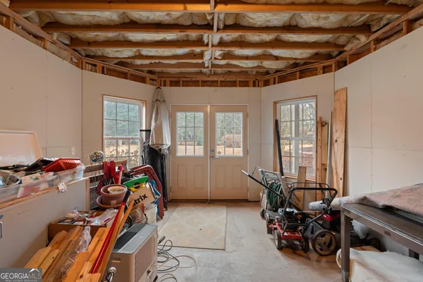 front view of a house with a rug