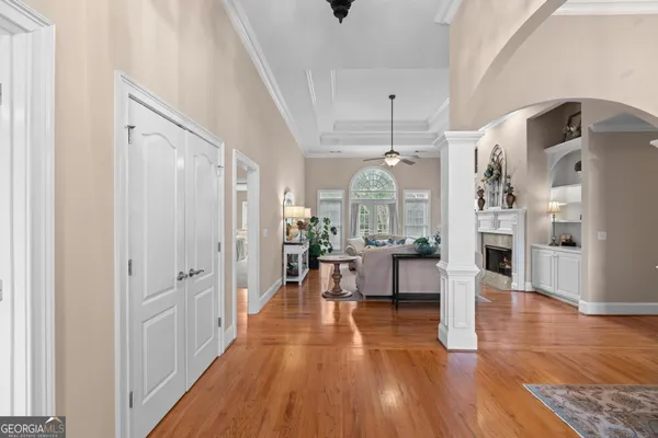 a dining room with furniture and chandelier