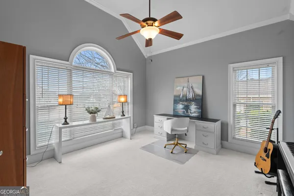 a view of a dining room with furniture a chandelier and a chandelier
