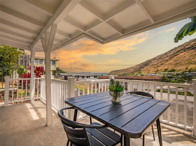 a view of a yard with wooden fence
