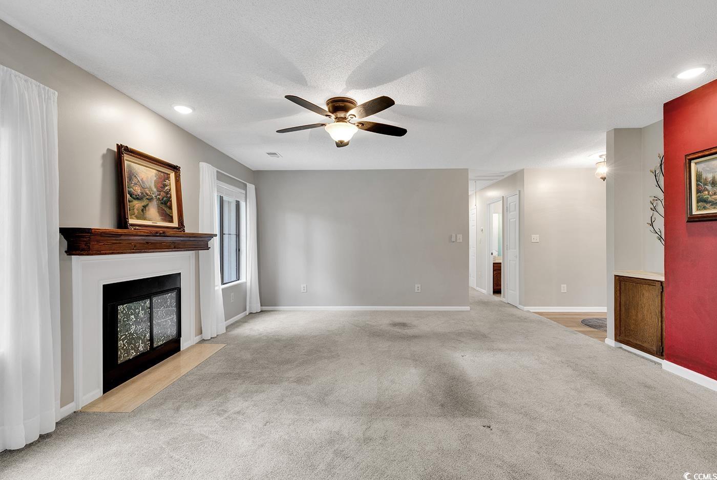 102 Berry Tree Lane Conway, SC 29526 - Photo 12 of 40 Unfurnished living room with ceiling fan, light co