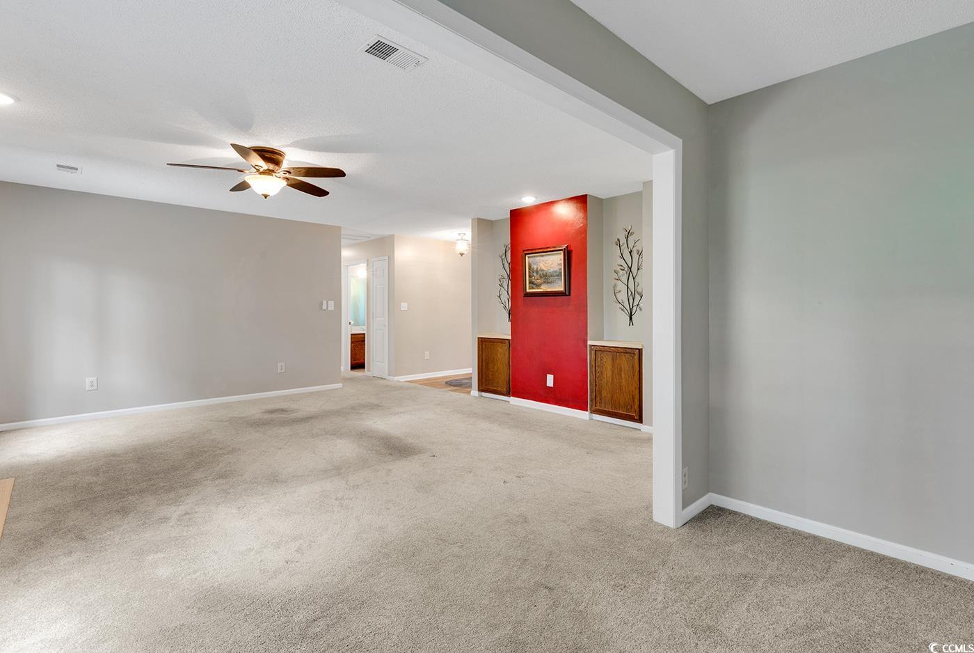 102 Berry Tree Lane Conway, SC 29526 - Photo 18 of 40 Carpeted spare room with ceiling fan