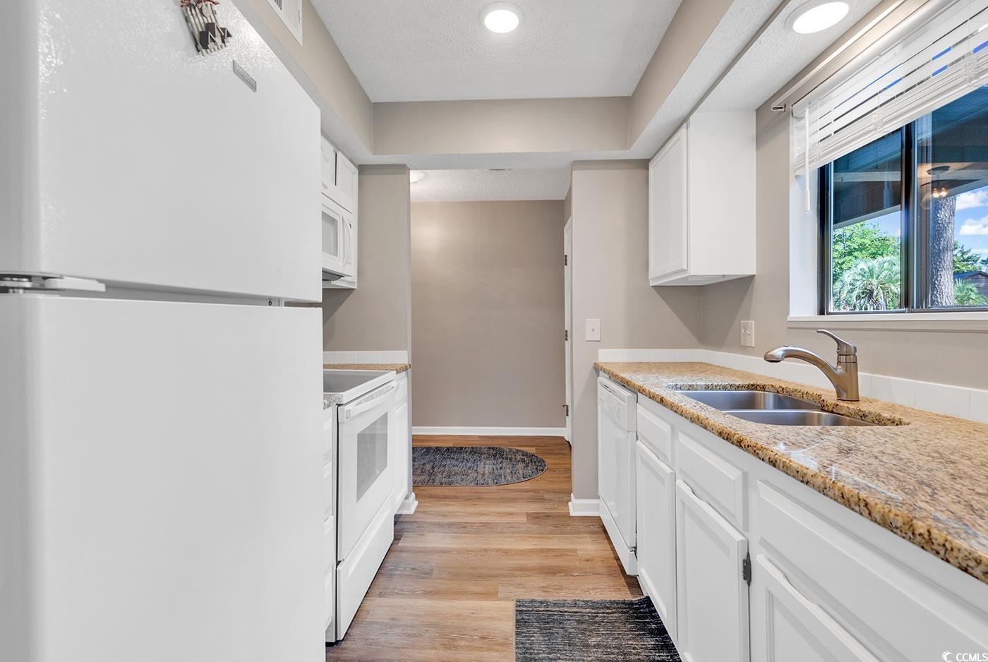 102 Berry Tree Lane Conway, SC 29526 - Photo 6 of 40 Kitchen with sink, white appliances, white cabinet