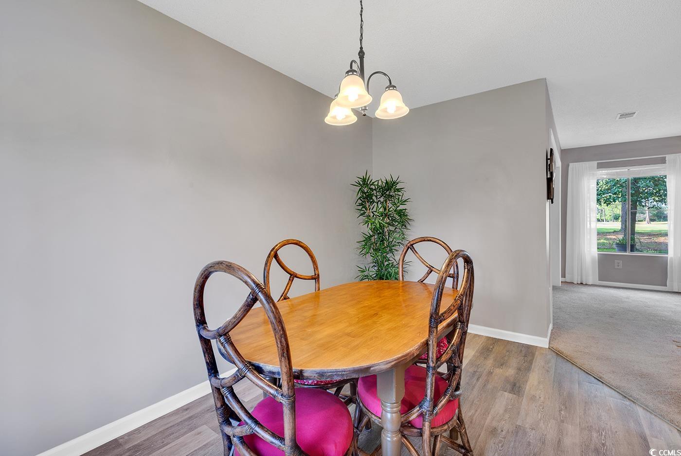 102 Berry Tree Lane Conway, SC 29526 - Photo 7 of 40 Dining room with a chandelier and hardwood / wood-