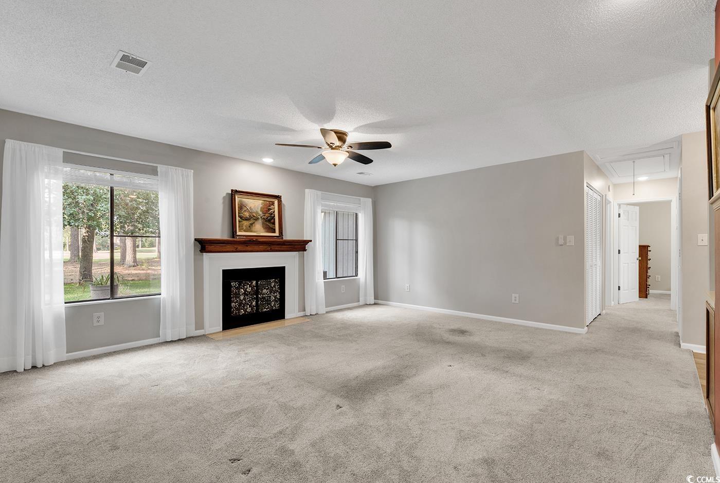 102 Berry Tree Lane Conway, SC 29526 - Photo 10 of 40 Unfurnished living room featuring ceiling fan, lig