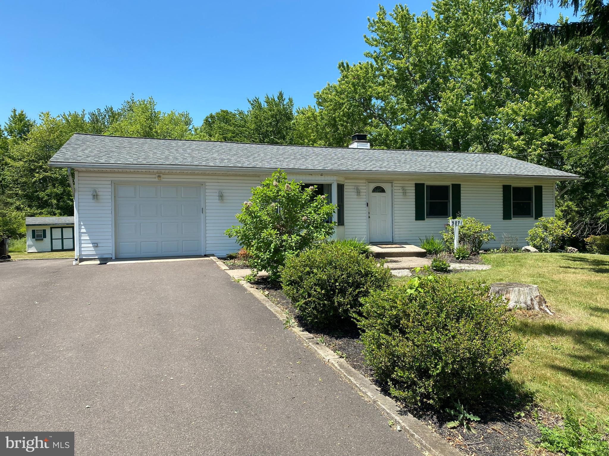 a front view of a house with yard