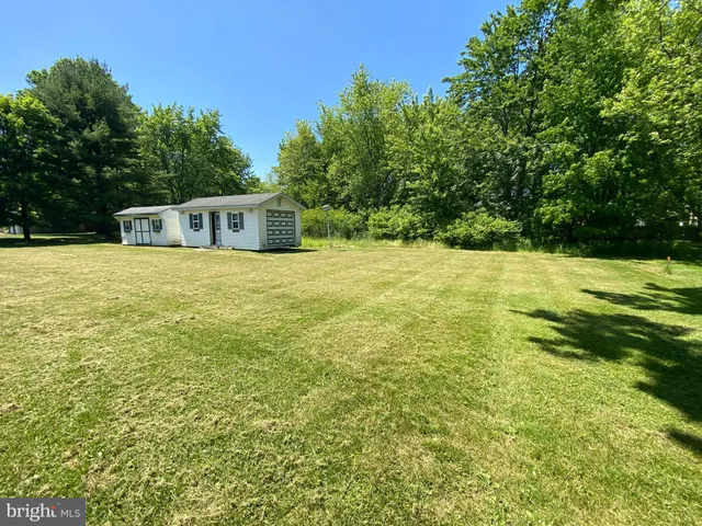 a view of an outdoor space and basketball court