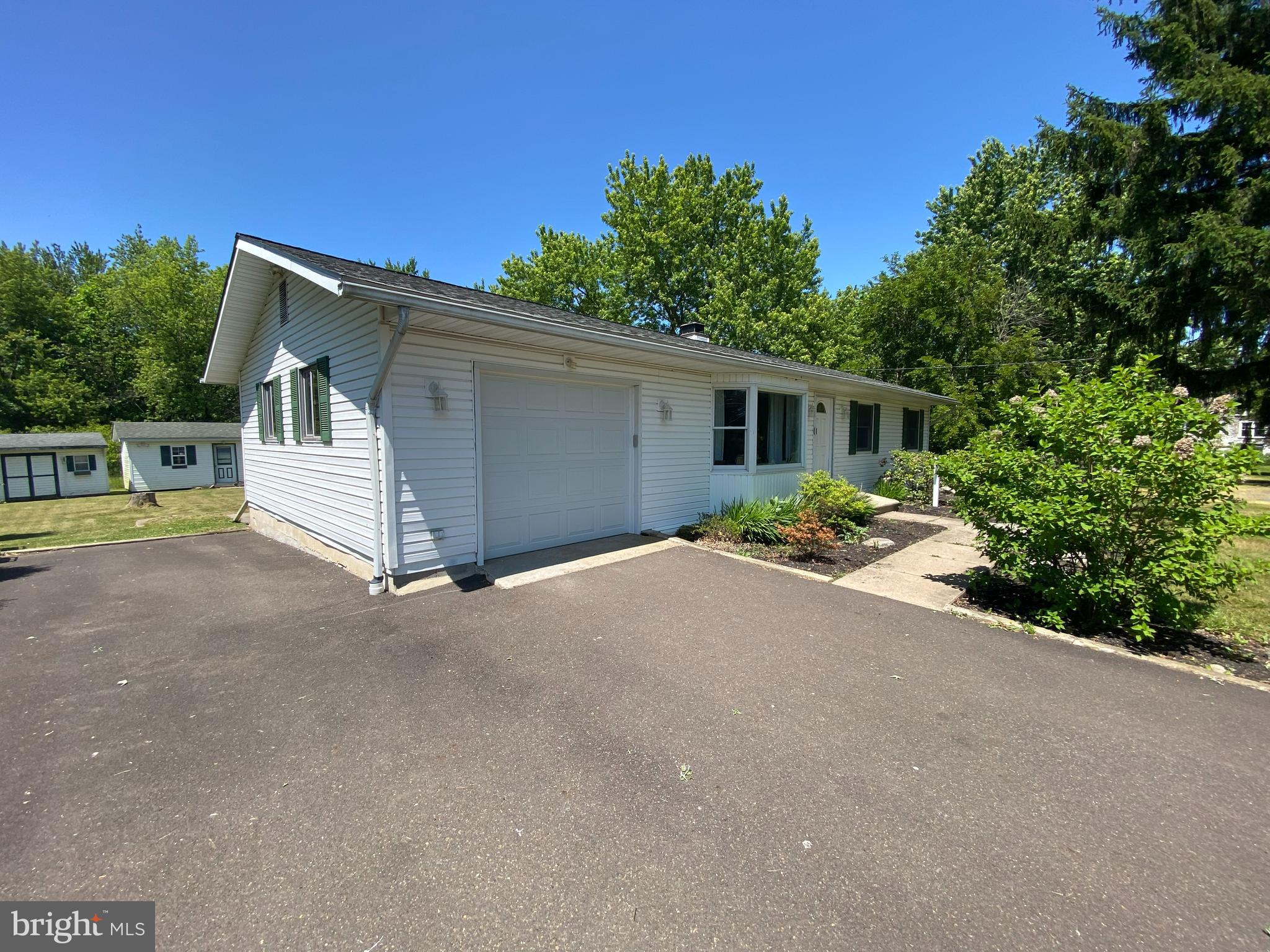 5871 Stump Road Pipersville, PA 18947 - Photo 3 of 33 a house with trees in the background