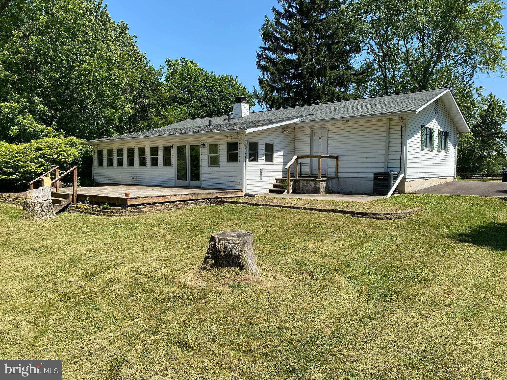 5871 Stump Road Pipersville, PA 18947 - Photo 4 of 33 a house that has a big yard with wooden fence