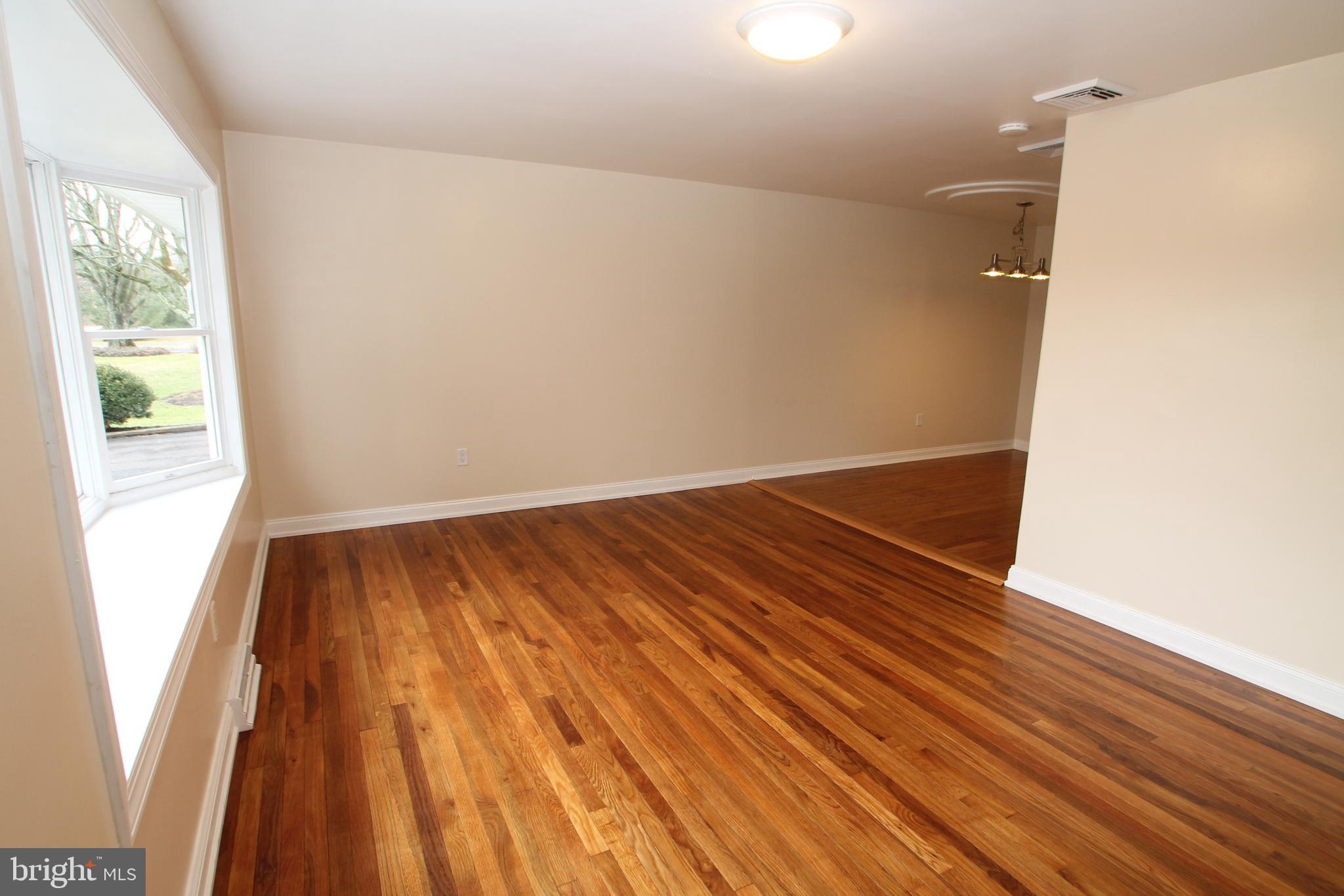 5871 Stump Road Pipersville, PA 18947 - Photo 8 of 33 an empty room with wooden floor and windows
