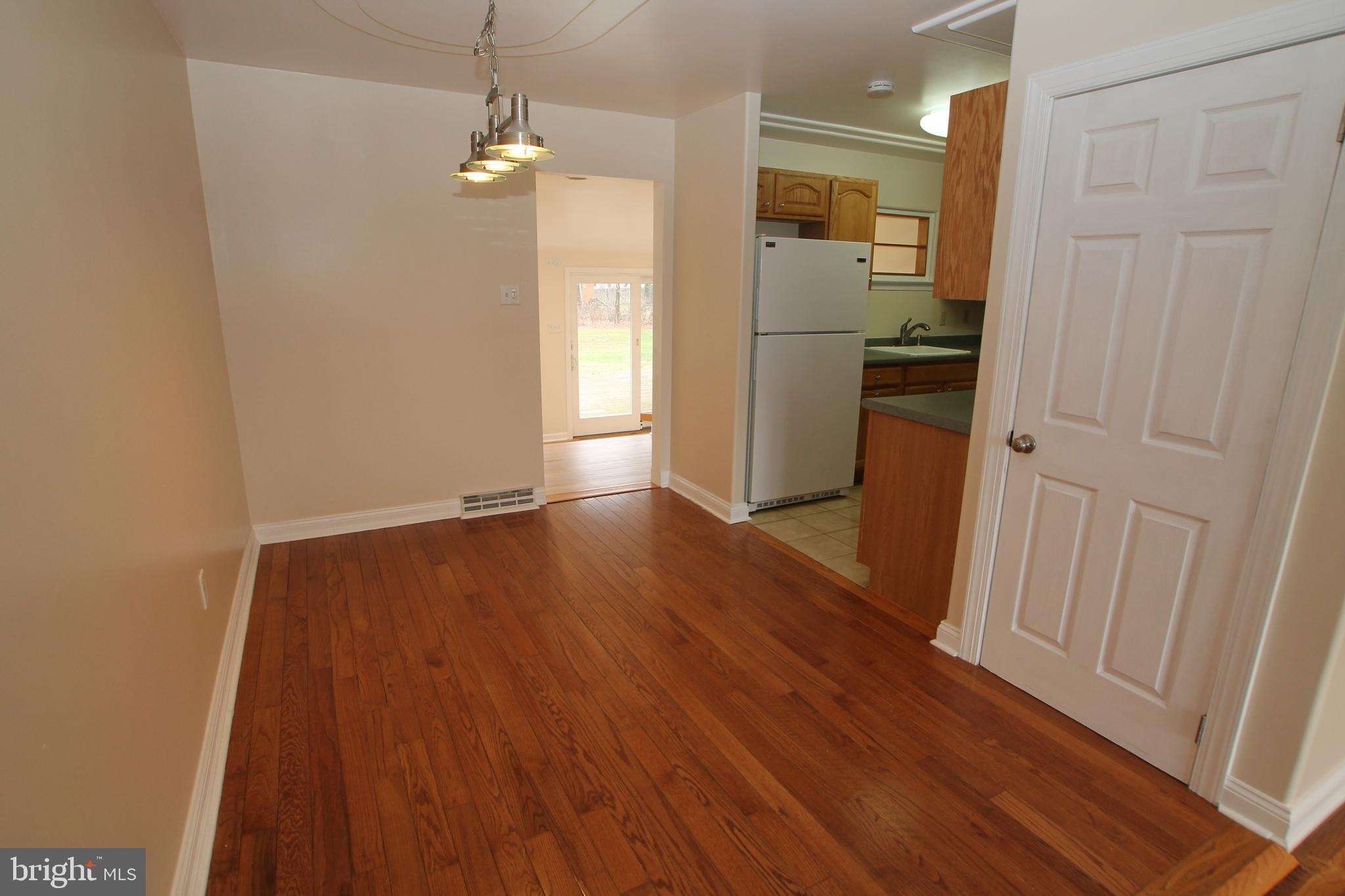 5871 Stump Road Pipersville, PA 18947 - Photo 10 of 33 a view of a hallway with wooden floor
