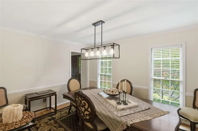 a view of a dining room with furniture window and outside view