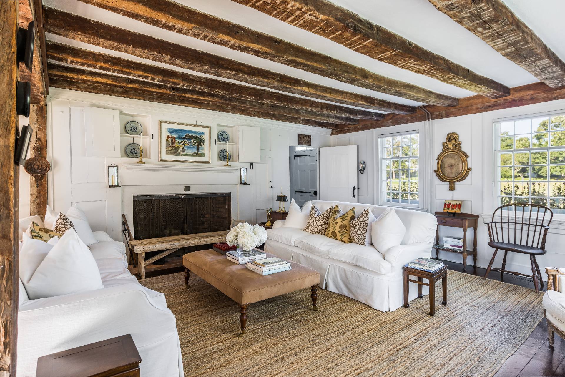 117 Egypt Lane East Hampton, NY 11937 - Photo 12 of 36 a living room with furniture and a fireplace