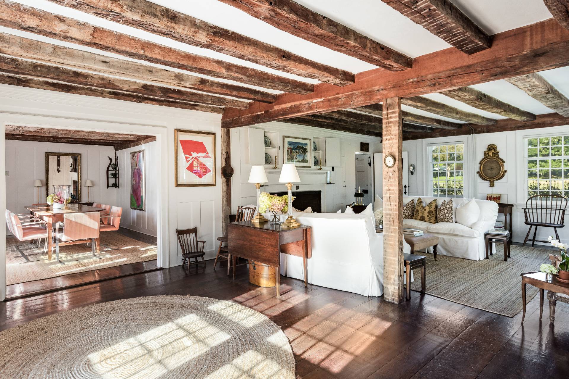 117 Egypt Lane East Hampton, NY 11937 - Photo 16 of 36 a living room with furniture and a chandelier