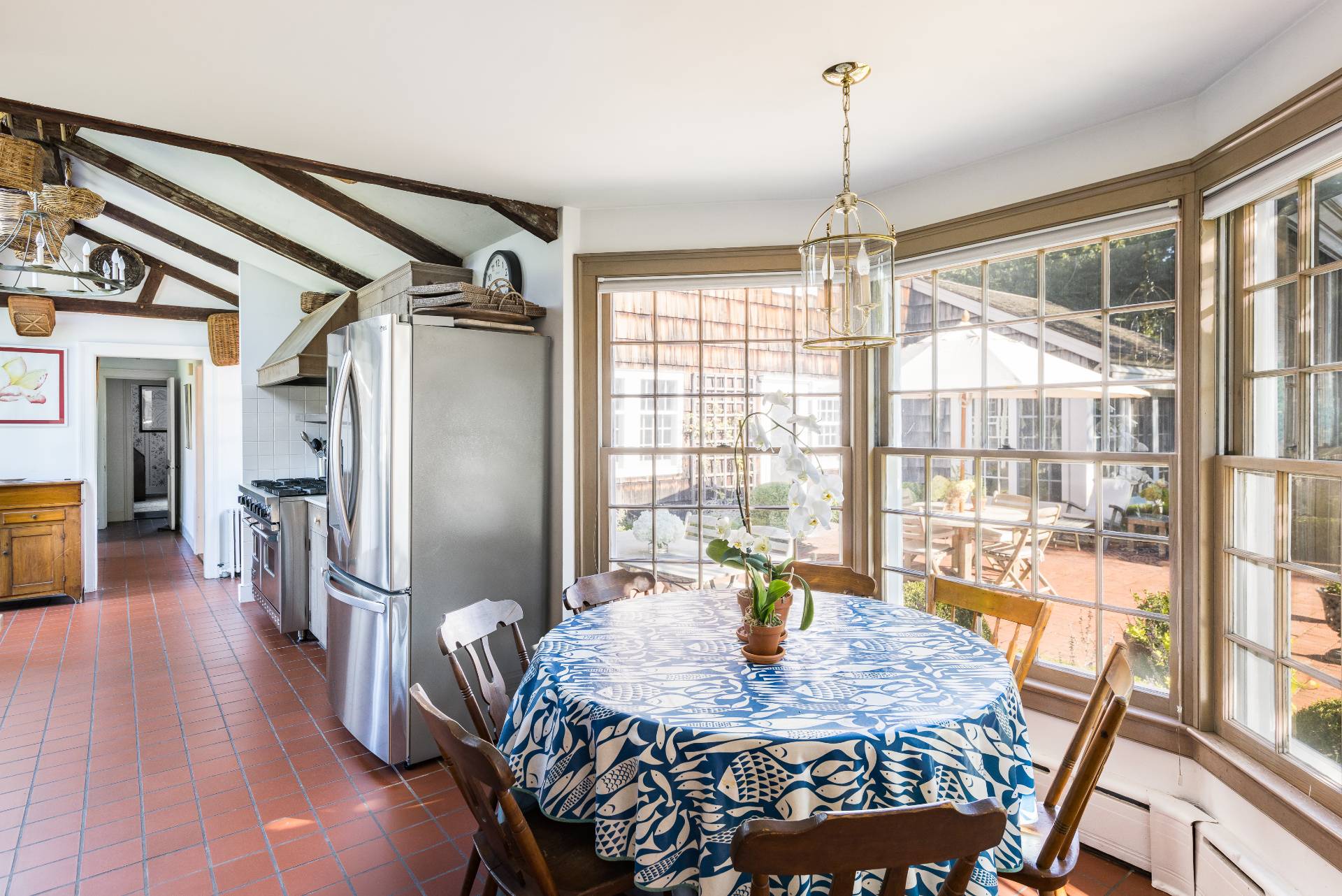 117 Egypt Lane East Hampton, NY 11937 - Photo 20 of 36 a dining room with furniture a chandelier and wooden floor