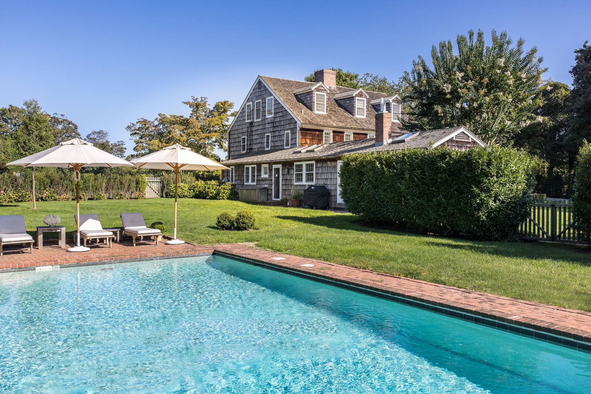 117 Egypt Lane East Hampton, NY 11937 - Photo 2 of 36 a view of a house with backyard and sitting area