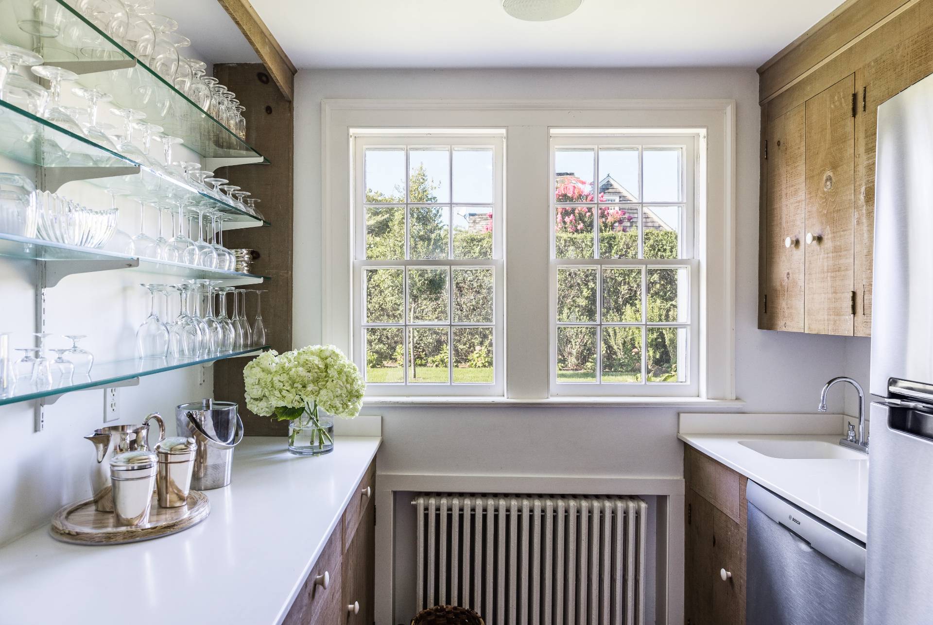 117 Egypt Lane East Hampton, NY 11937 - Photo 21 of 36 a kitchen with a window a sink and cabinets