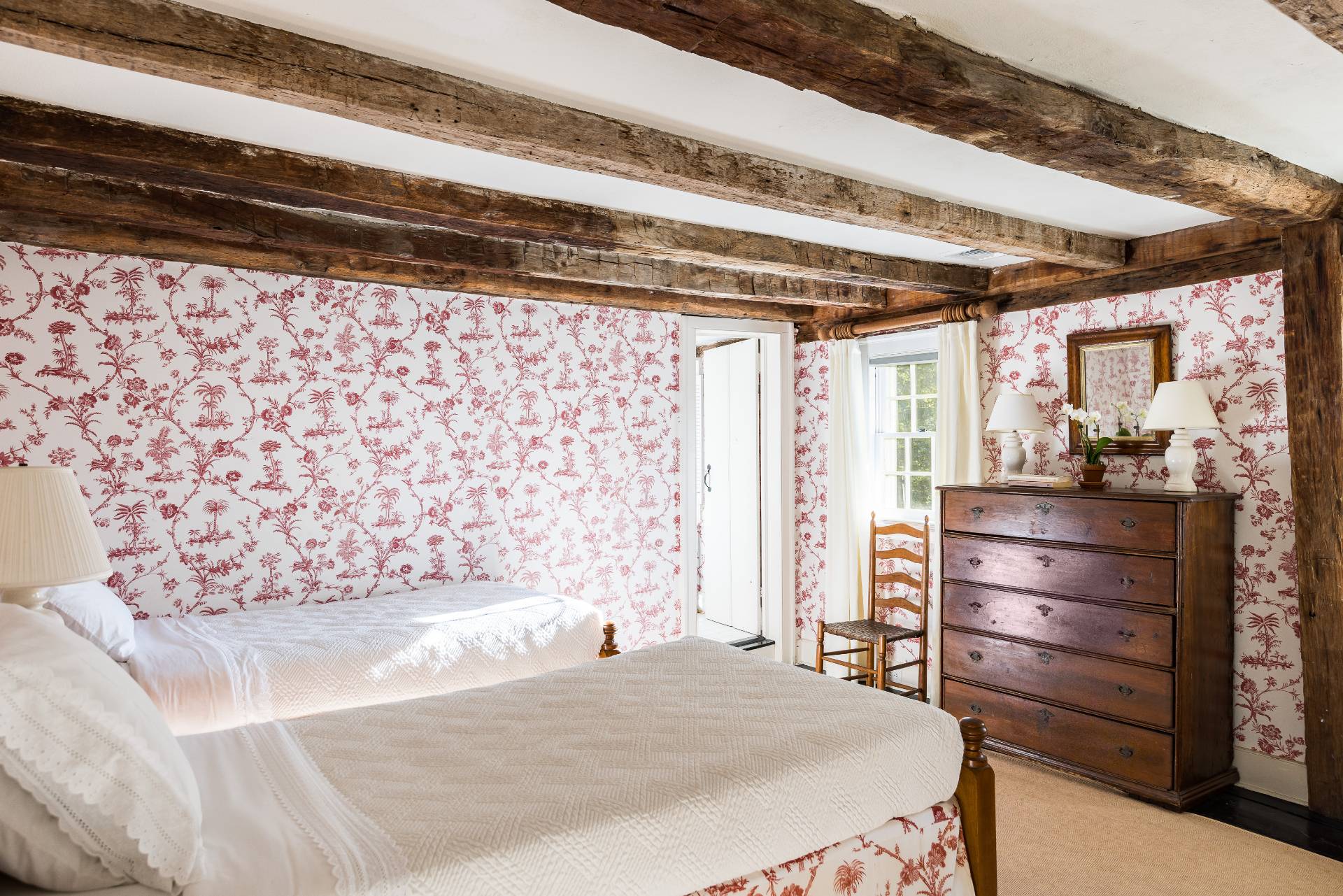 117 Egypt Lane East Hampton, NY 11937 - Photo 28 of 36 a bedroom with a bed and a dresser