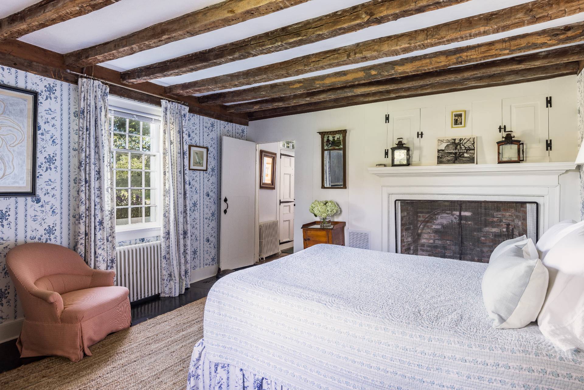 117 Egypt Lane East Hampton, NY 11937 - Photo 30 of 36 a bedroom with furniture and a fireplace