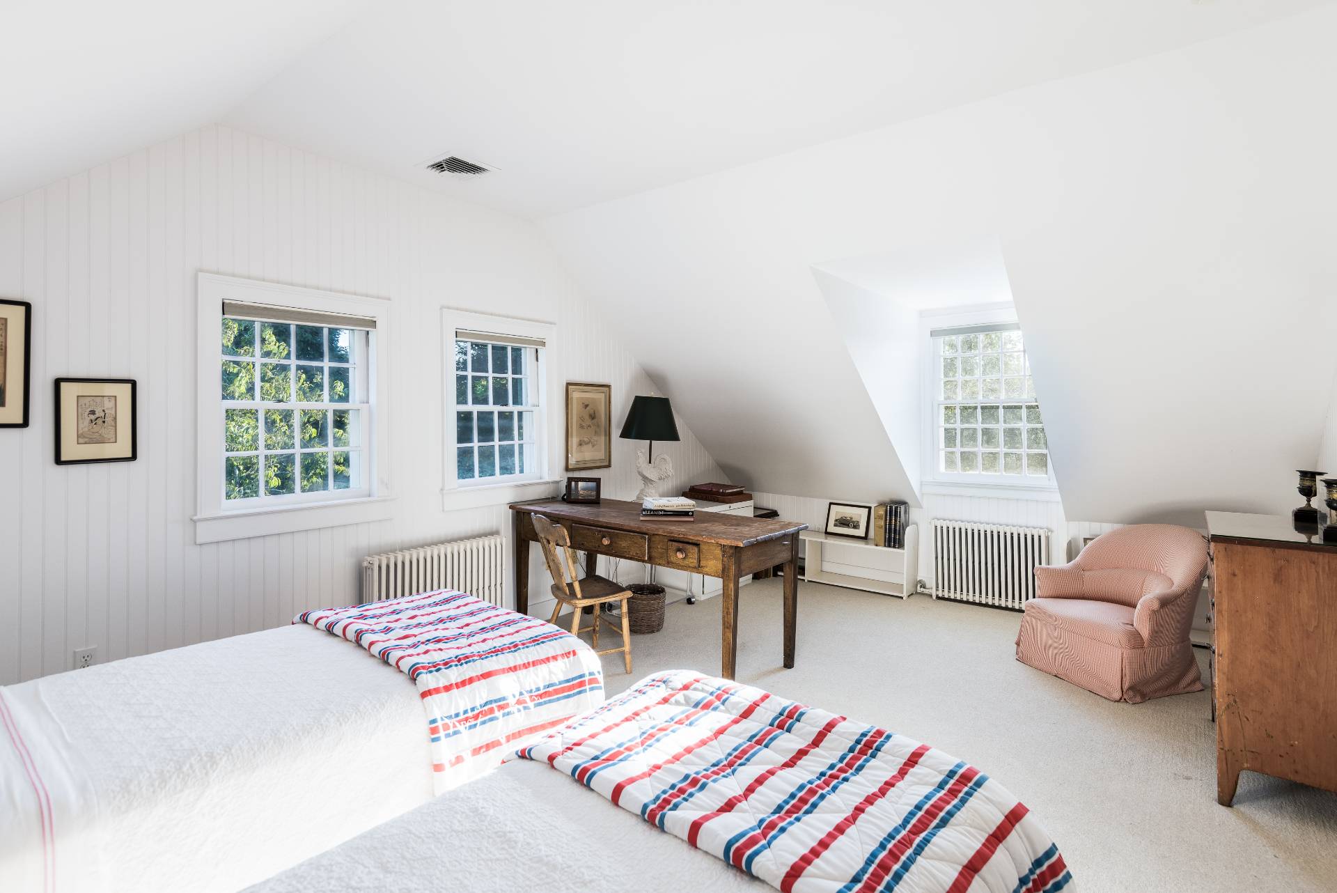 117 Egypt Lane East Hampton, NY 11937 - Photo 32 of 36 a bedroom with a bed and a table in it with window