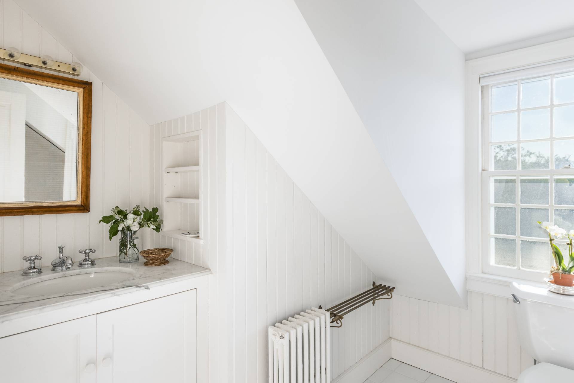 117 Egypt Lane East Hampton, NY 11937 - Photo 36 of 36 a bathroom with a sink and a mirror