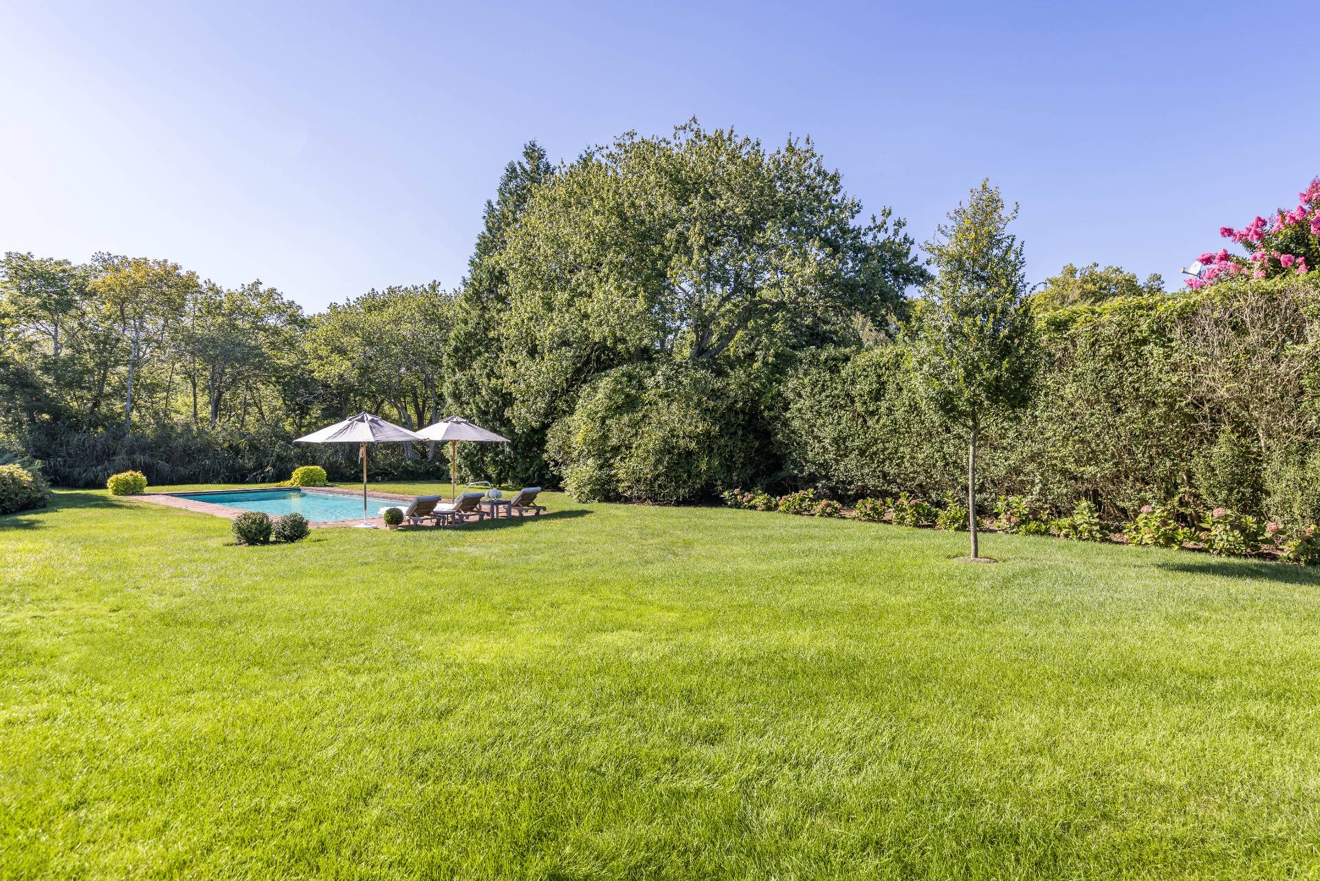 117 Egypt Lane East Hampton, NY 11937 - Photo 8 of 36 a house with trees in the background
