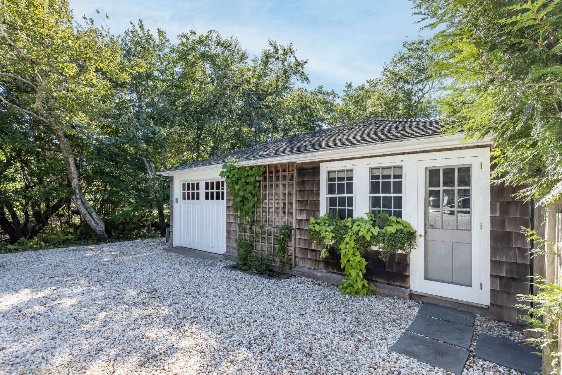 117 Egypt Lane East Hampton, NY 11937 - Photo 9 of 36 a view of a house with a yard and plants