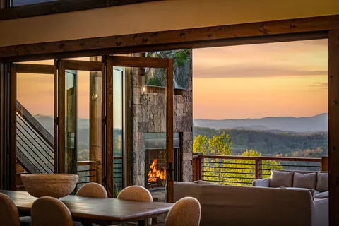 a view of balcony with couch and chairs