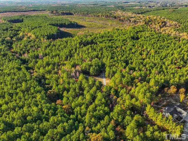a view of a lake with top of house