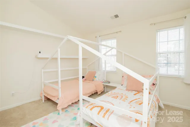 a view of a bedroom with a window