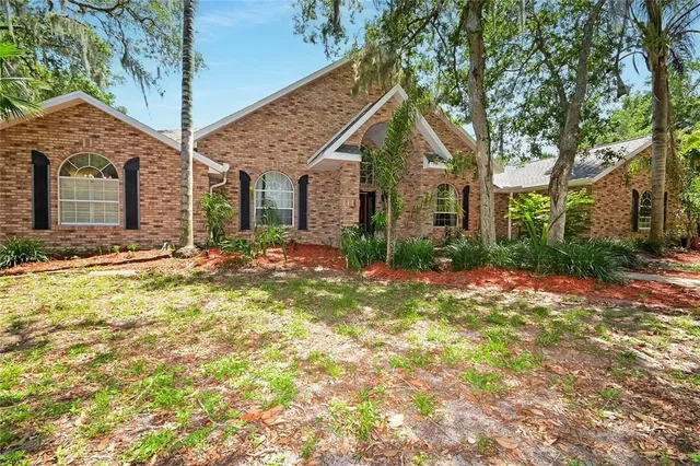 a view of a house with a yard