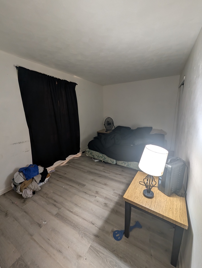 6232-6234 Appomattox Road Davenport, IA 52806 - Photo 7 of 21 a bedroom with a bed and a mirror