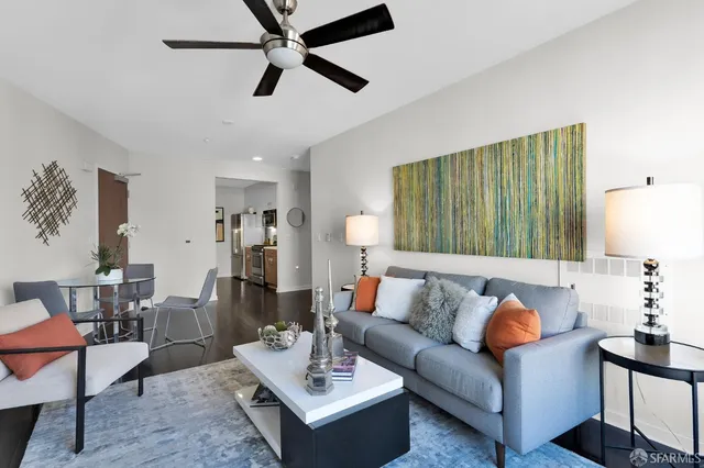 a living room with furniture and a rug