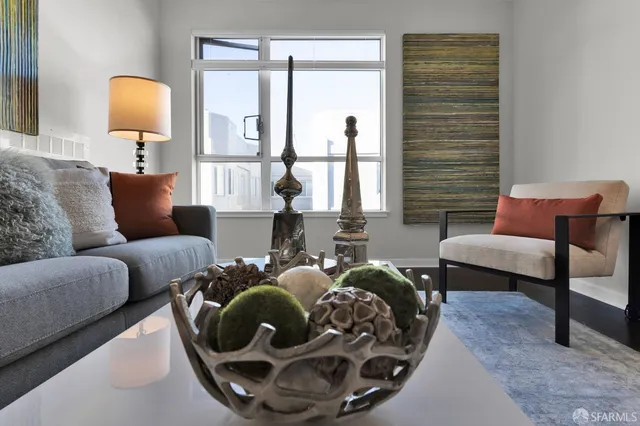 a living room with furniture and a lamp