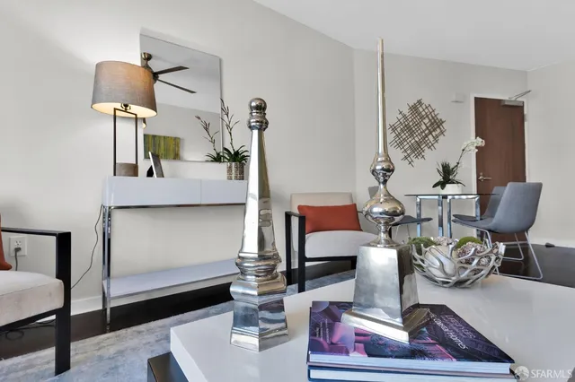 a living room with furniture and a lamp