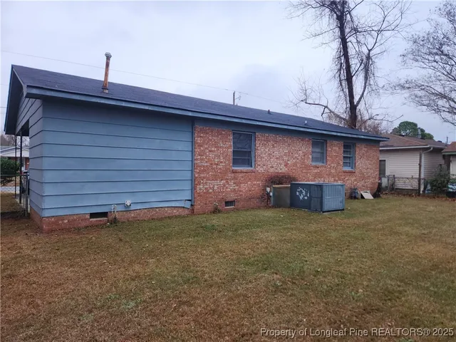 a backyard of a house with oven and garden