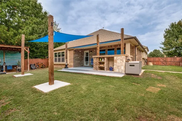 a kitchen with stainless steel appliances granite countertop a sink dishwasher and refrigerator
