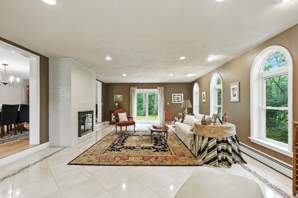 61 Pond Street Boxford, MA 01921 - Photo 16 of 38 a living room with furniture hard wood floor and a rug