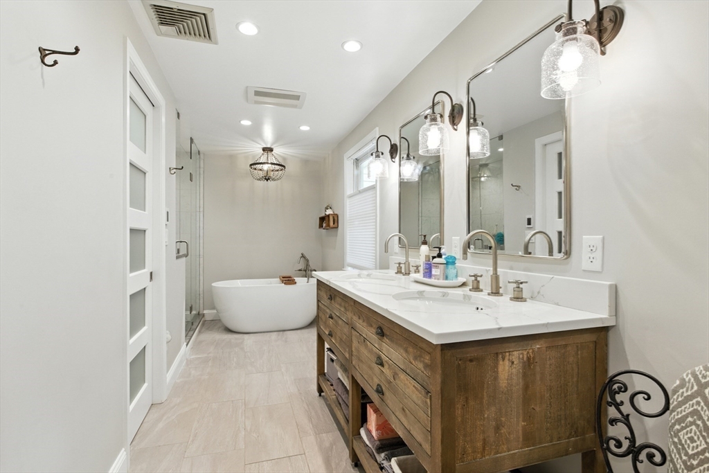 61 Pond Street Boxford, MA 01921 - Photo 21 of 38 a spacious bathroom with a double vanity sink mirror and bathtub