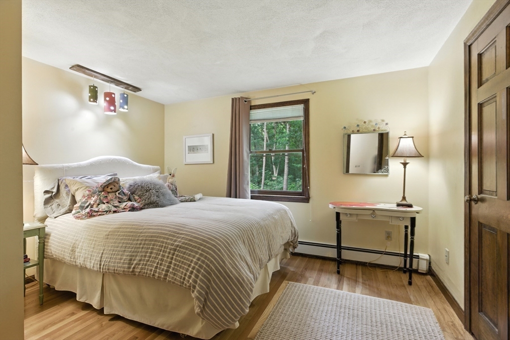 61 Pond Street Boxford, MA 01921 - Photo 29 of 38 a bedroom with a bed and window