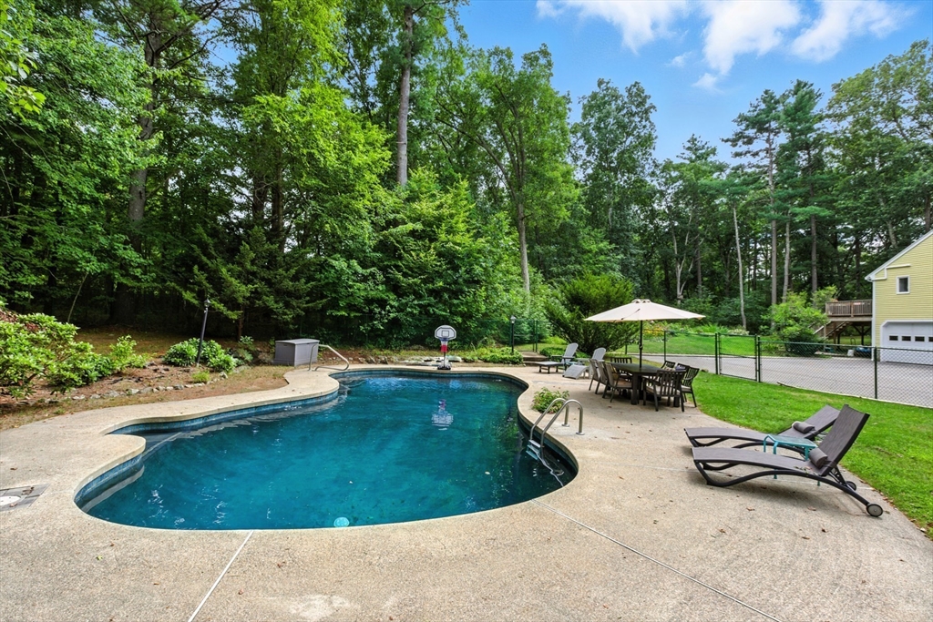 61 Pond Street Boxford, MA 01921 - Photo 3 of 38 a view of a swimming pool and lounge chair