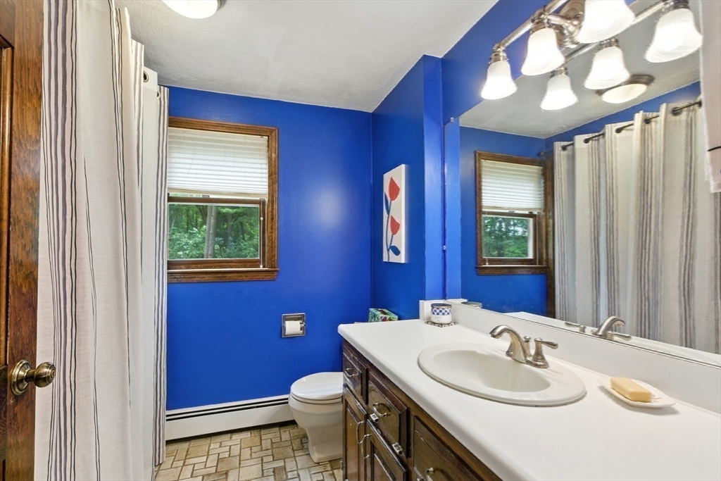 61 Pond Street Boxford, MA 01921 - Photo 32 of 38 a bathroom with a sink and a mirror
