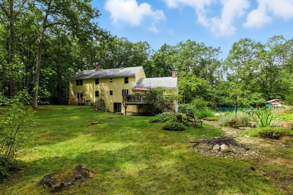 61 Pond Street Boxford, MA 01921 - Photo 38 of 38 a view of a house with a backyard