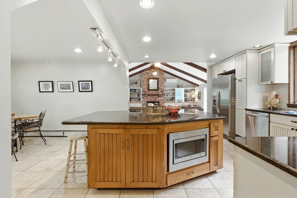 61 Pond Street Boxford, MA 01921 - Photo 5 of 38 a kitchen with stainless steel appliances granite countertop a stove and a sink