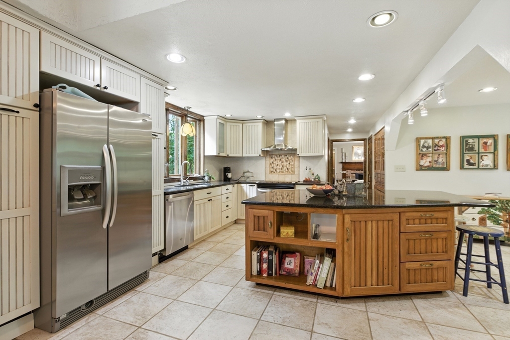 61 Pond Street Boxford, MA 01921 - Photo 6 of 38 a kitchen with stainless steel appliances granite countertop a refrigerator and a stove top oven